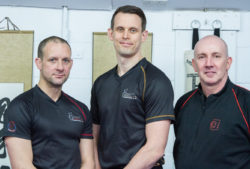 Russell Webster with Sifu Ashley Phillips (L) and Sifu Gary Cooper (R)
