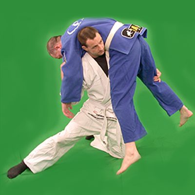 Ashley Phillips Sifu performing a grappling takedown